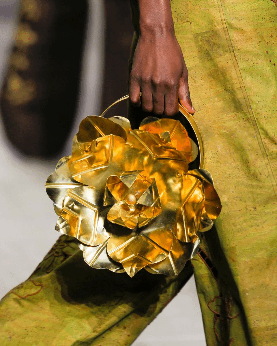 A bag made using scrap brass metal pieces by behen studios sold by two extra lives