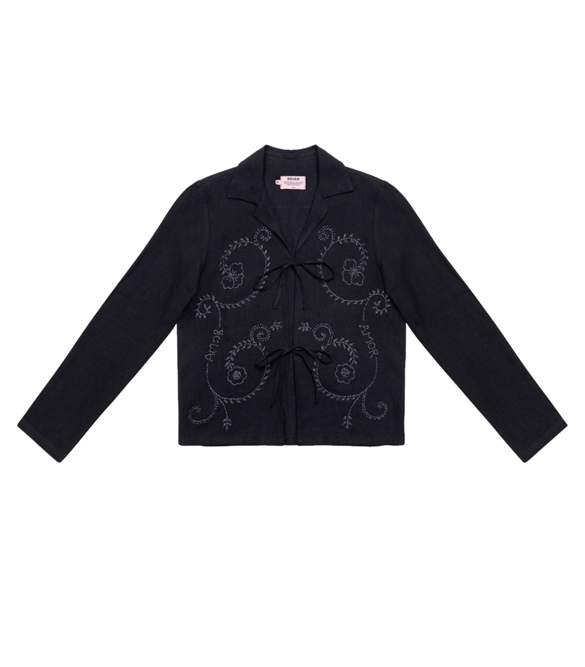 A long sleeve black shirt with white embroidery and glass beads, featuring a camp collar and straight hem. Béhen - Amor Viana Shirt sold by two extra lives