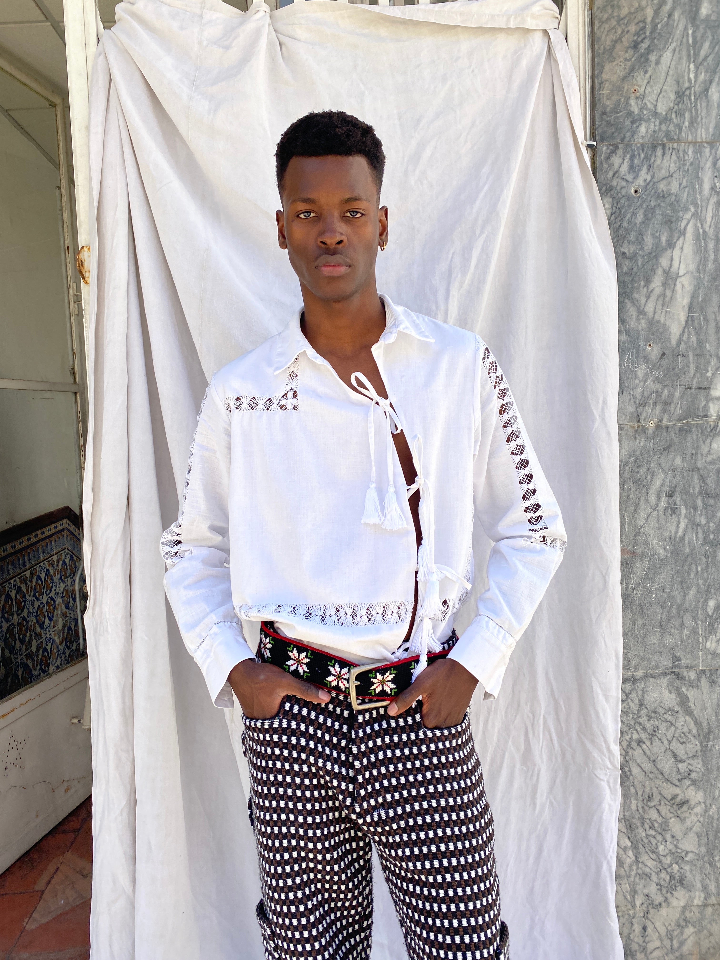 Campino shirt from Béhen Studios with an asymmetric front opening and tassels to tie, offers a distinctive twist on the classic design. sold by two extra lives