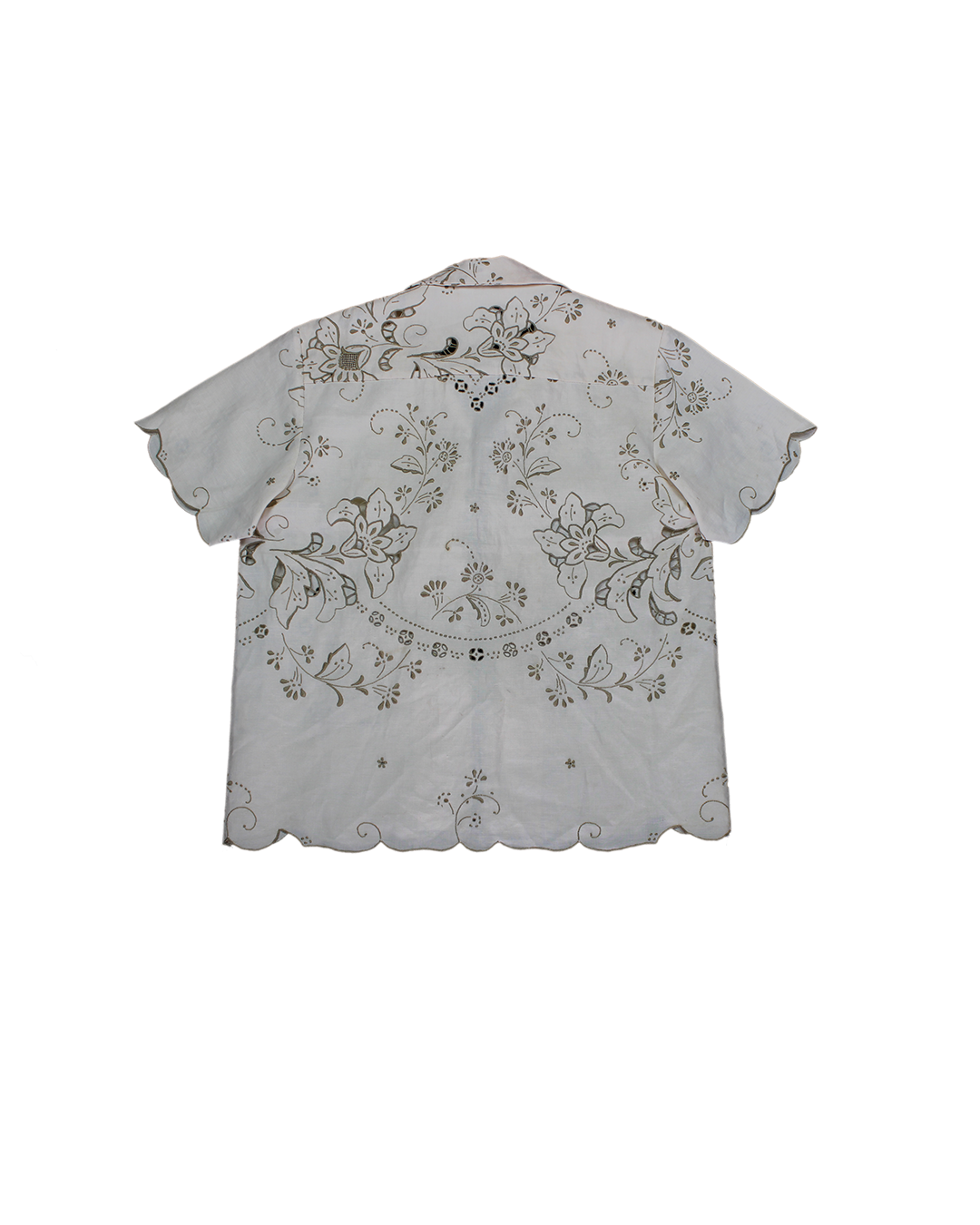 A white linen shirt with short sleeves and embroidered floral patterns on the front and back, displayed on a hanger. Béhen- Madeira Embroidery Shirt sold by two extra lives