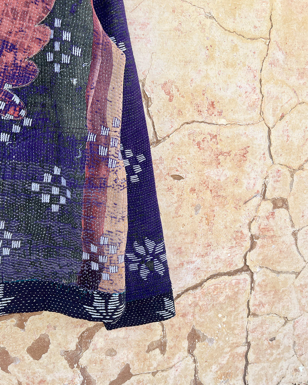 Textured fabric with floral patterns on a stone surface DAY-AND-AGE-BHERUNDA-JACKET-TWO-EXTRA-LIVES