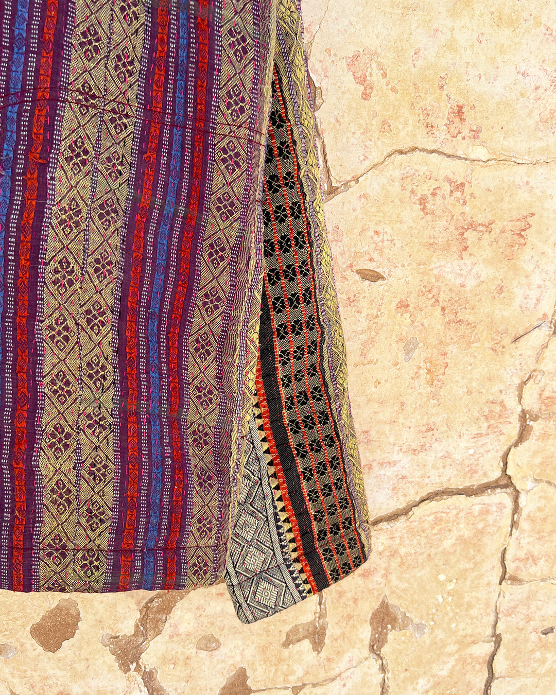 Textile with intricate patterns on a stone surface DAY-AND-AGE-REX-JACKET-TWO-EXTRA-LIVES