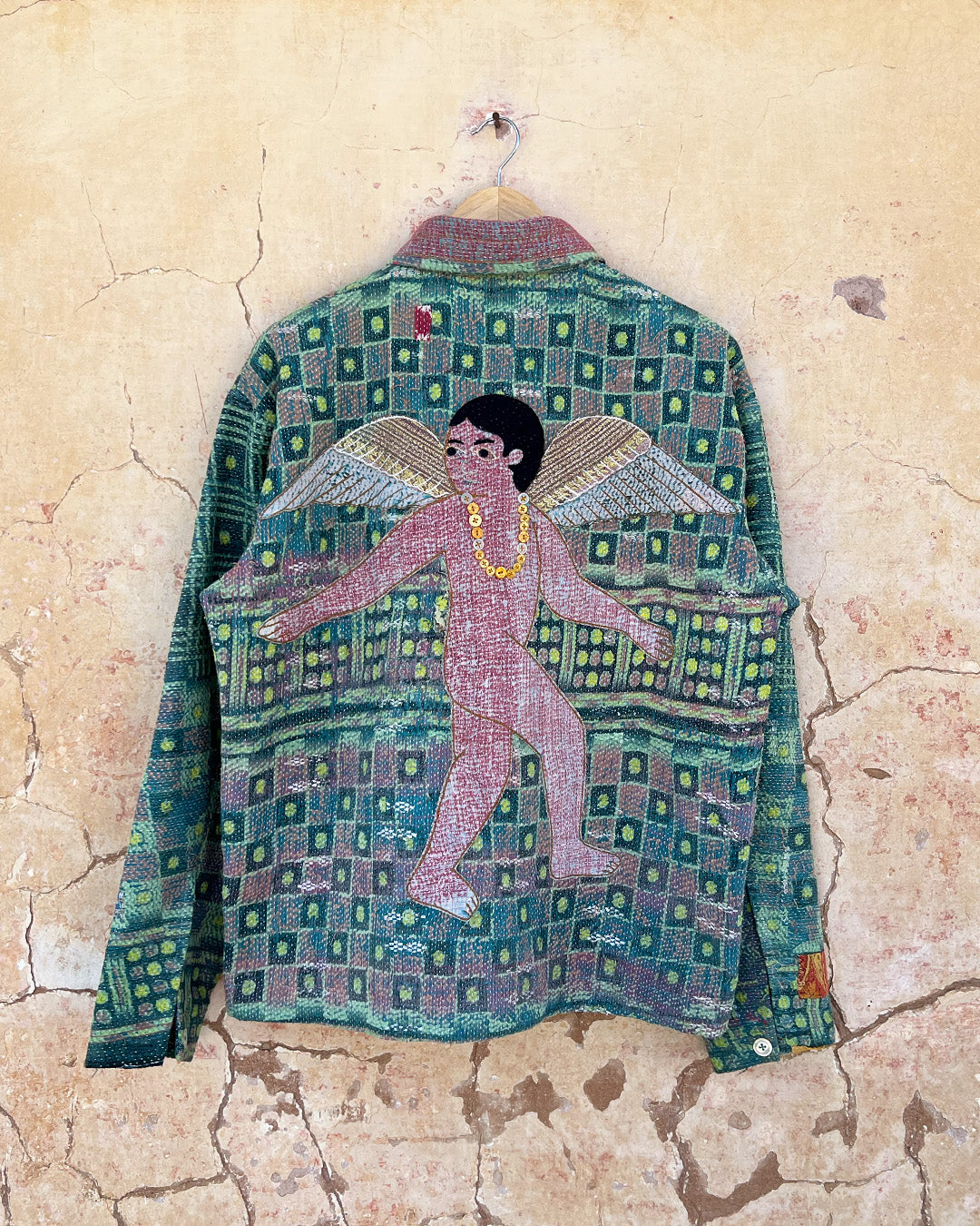 Colorful shirt with angel design on a textured beige background DAY-AND-AGE-YAKSHI-JACKET-TWO-EXTRA-LIVES