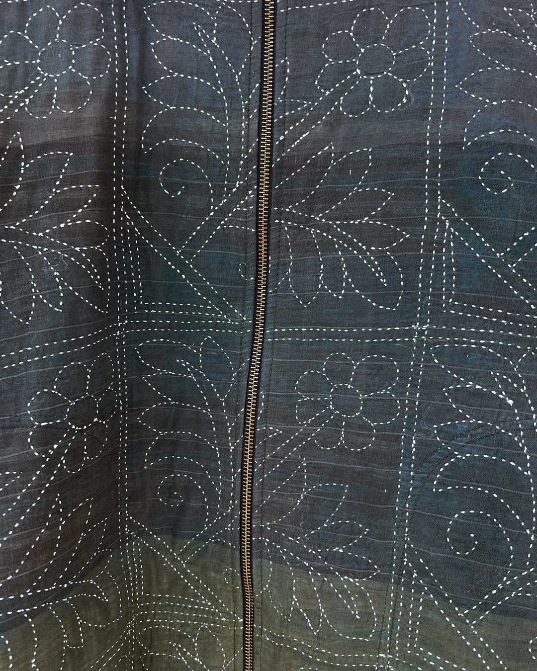 Dark green quilted jacket by Day and age on a mannequin by two extra lives