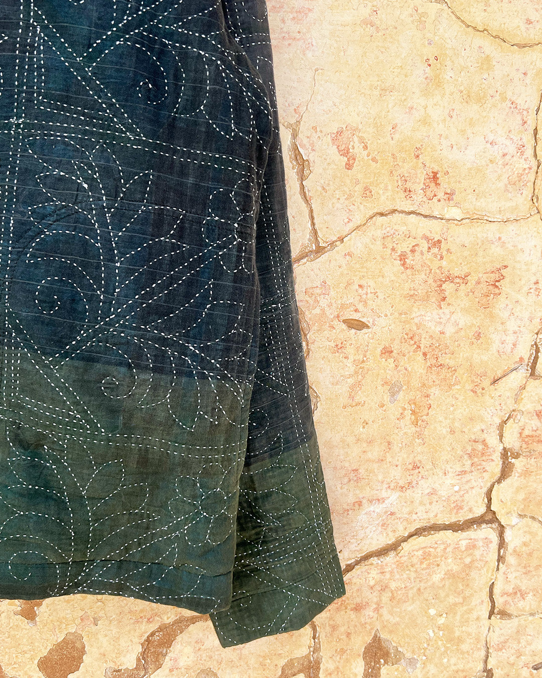 Dark green quilted jacket by Day and age on a mannequin by two extra lives