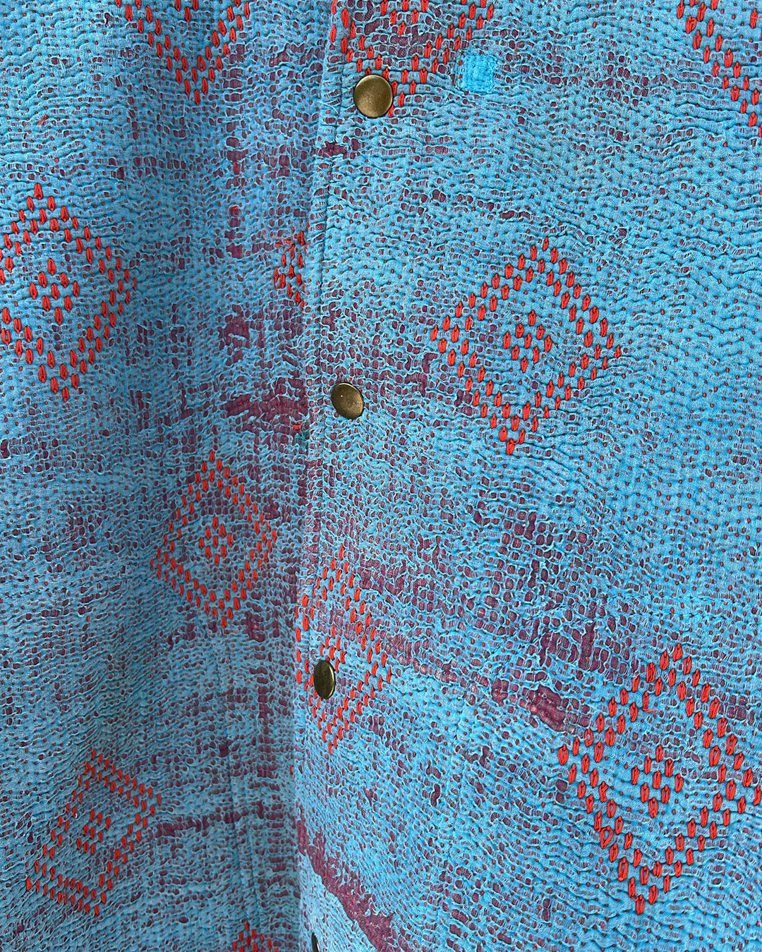 Blue patterned jacket by Day and Age on a textured beige background sold by two extra lives