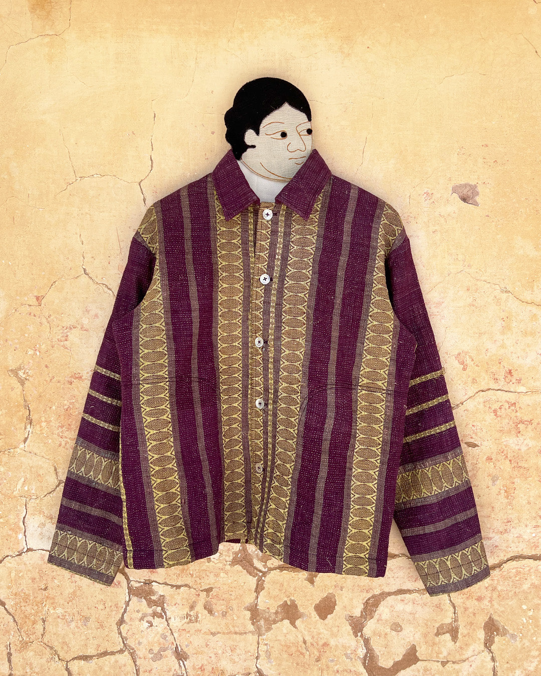 Traditional patterned shirt on a textured beige background Day-and-age-regal-jacket-two-extra-lives