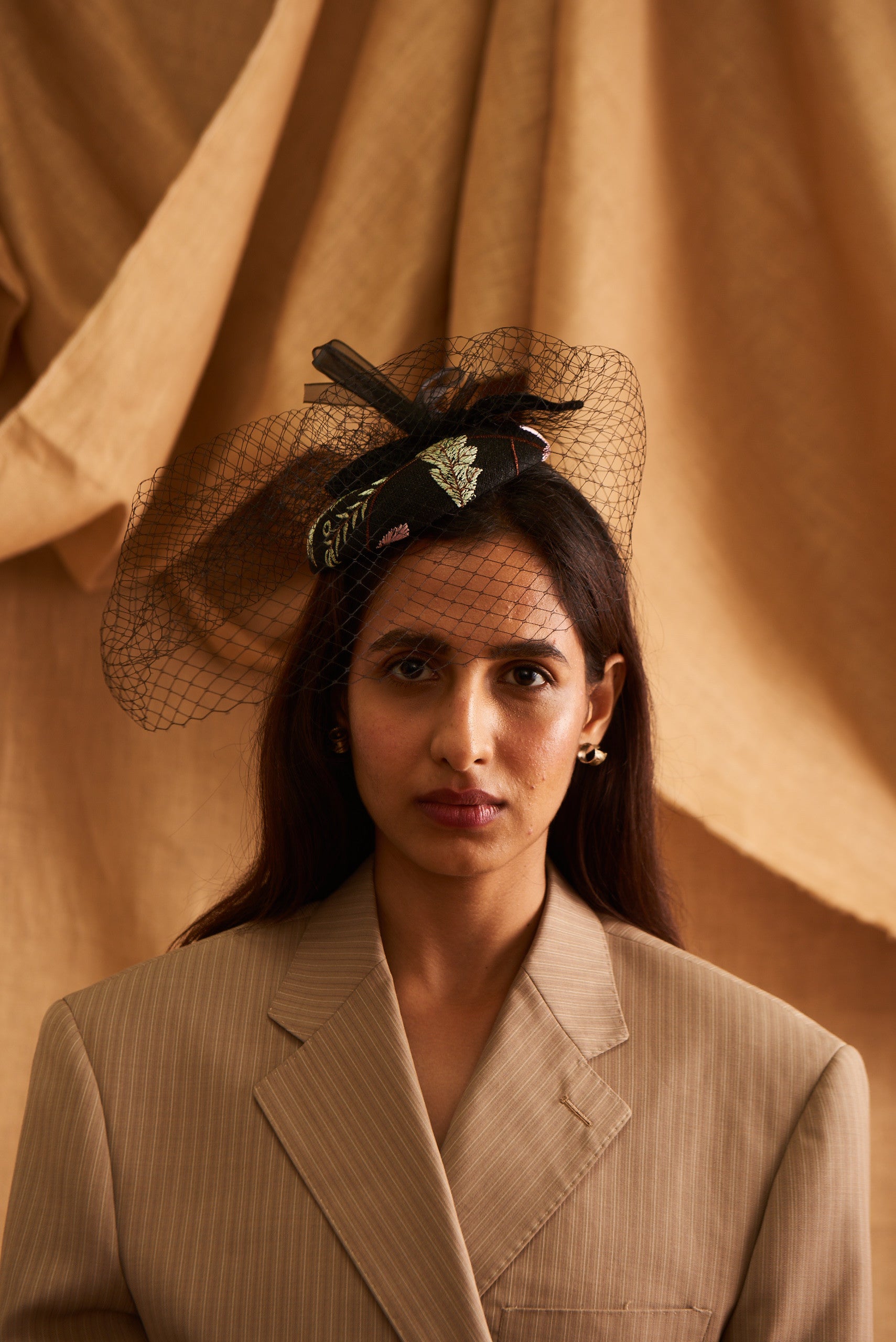 A woman wearing a black mesh beret with a floral pattern 
Kitty Comet - Filet De Fleurs Noir Beret sold by two extra lives