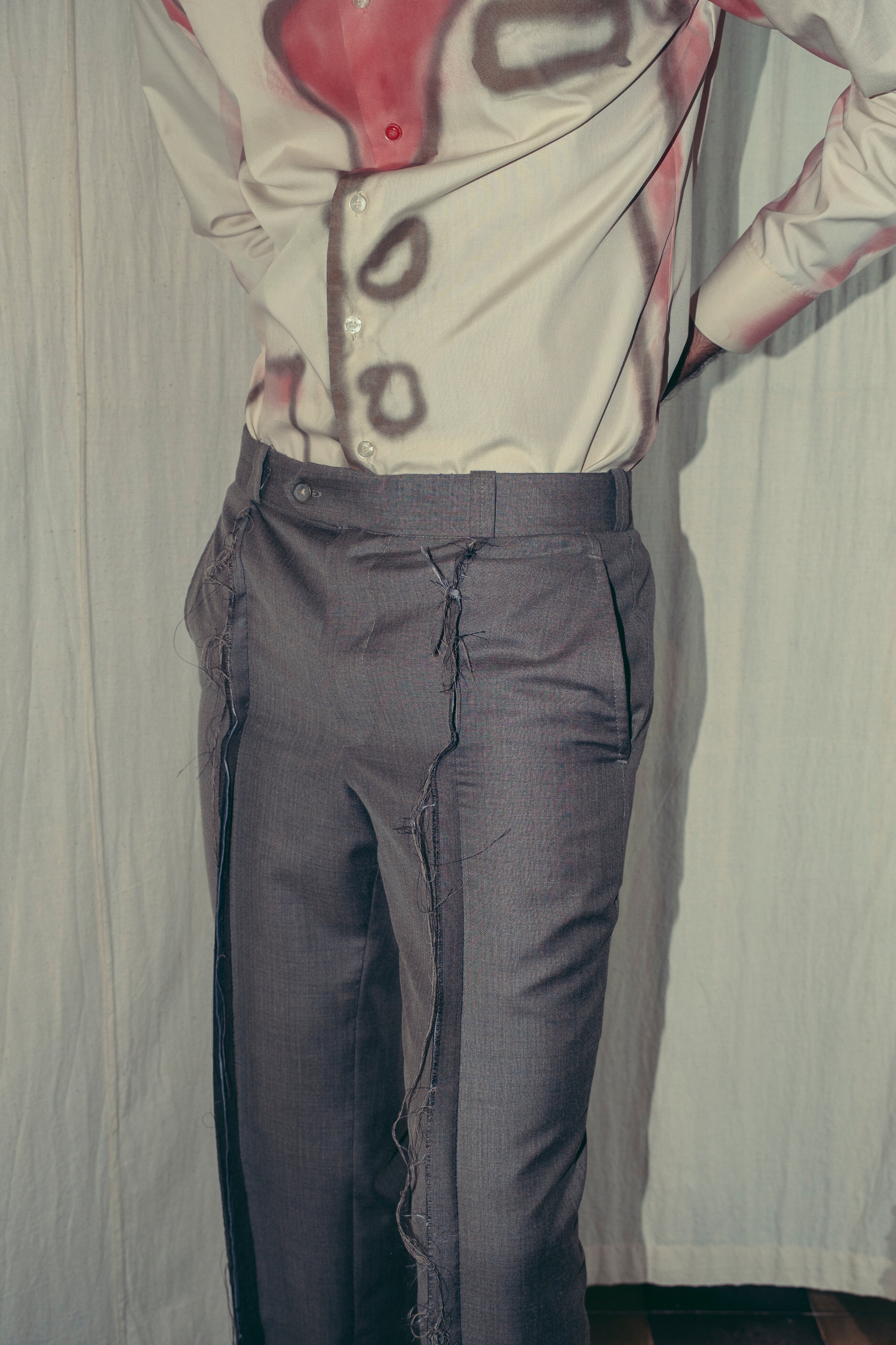 A person wearing grey inside-out pants Kuta House - Grey Inside-Out Pants two extra lives