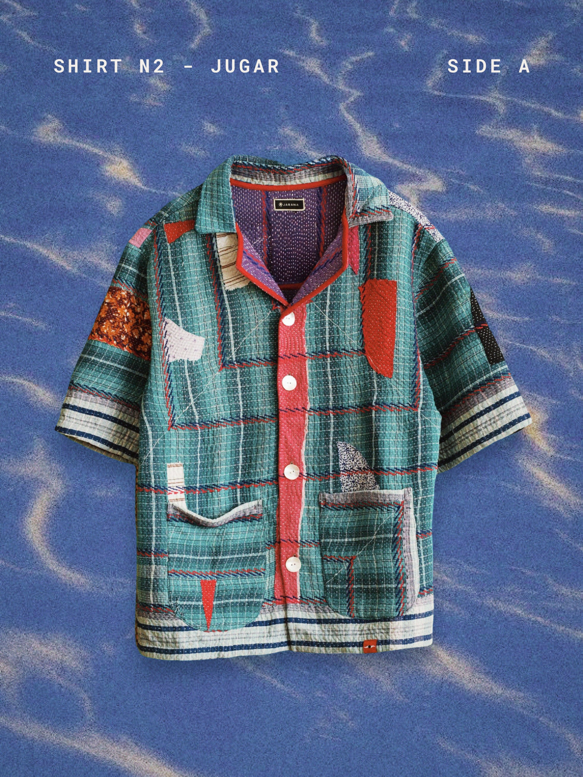 Colorful shirt with patchwork design on a blue textured background