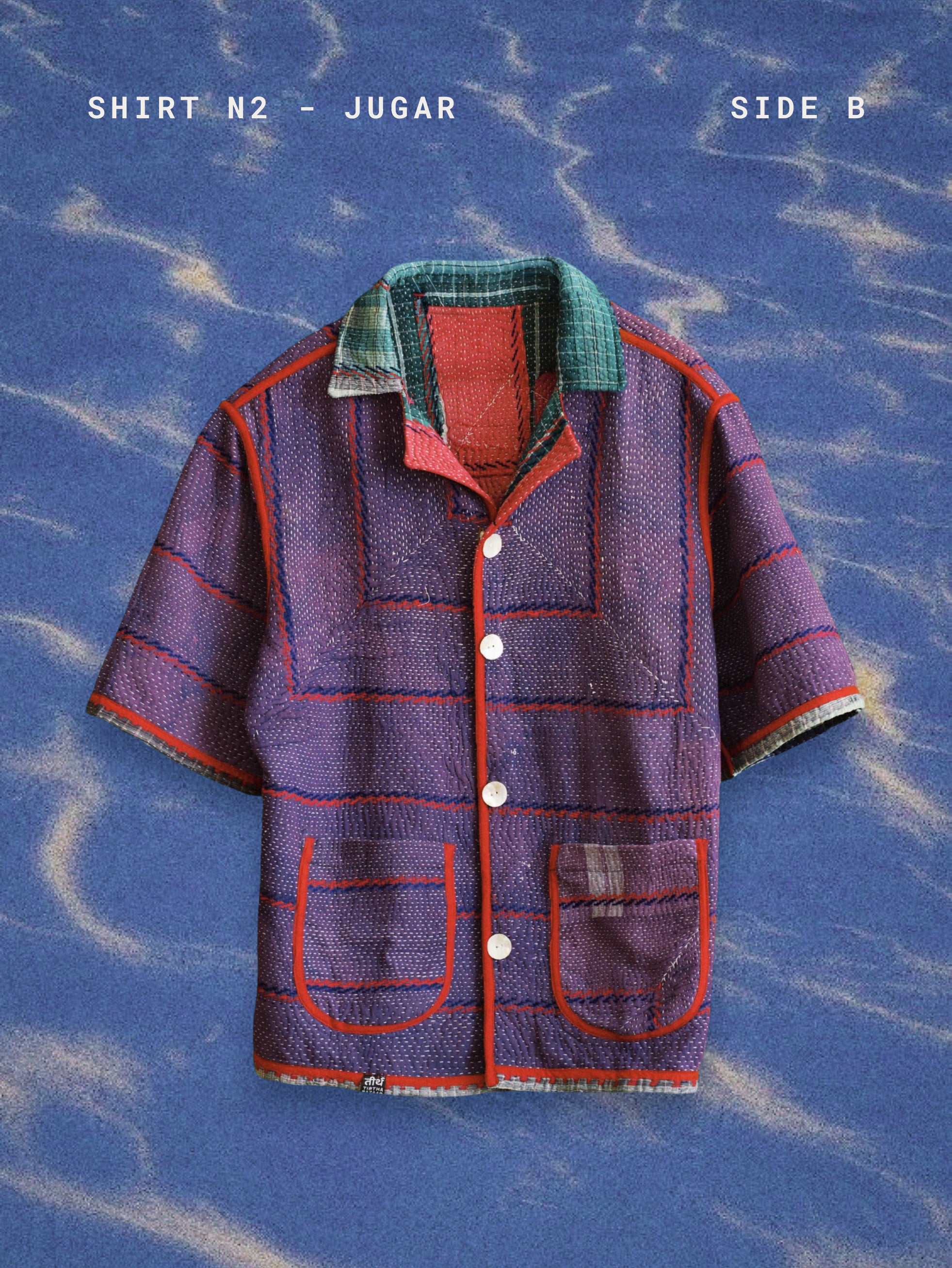 Purple shirt with green collar and red accents on a blue textured background