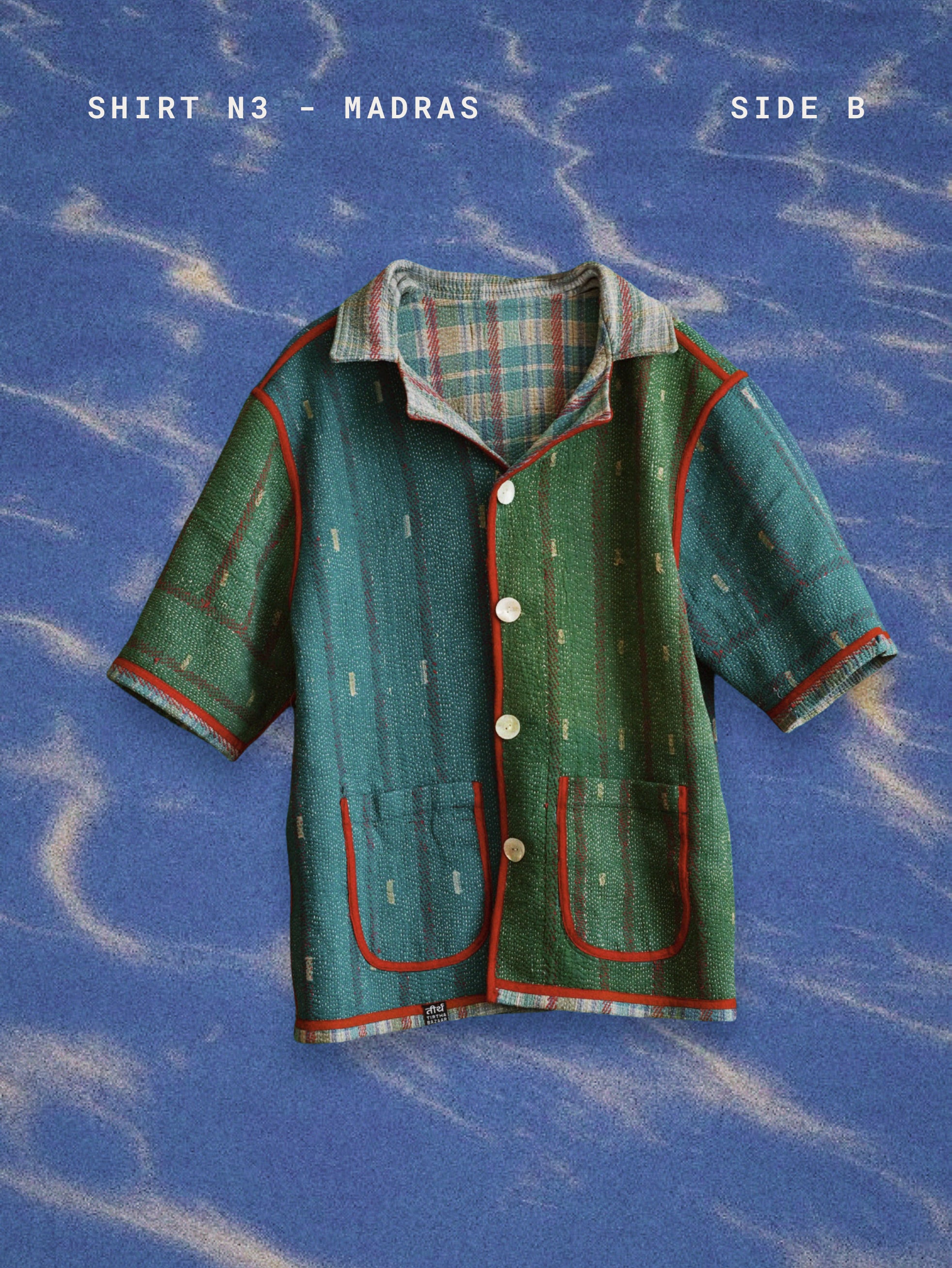 Green shirt with plaid collar on a blue textured background