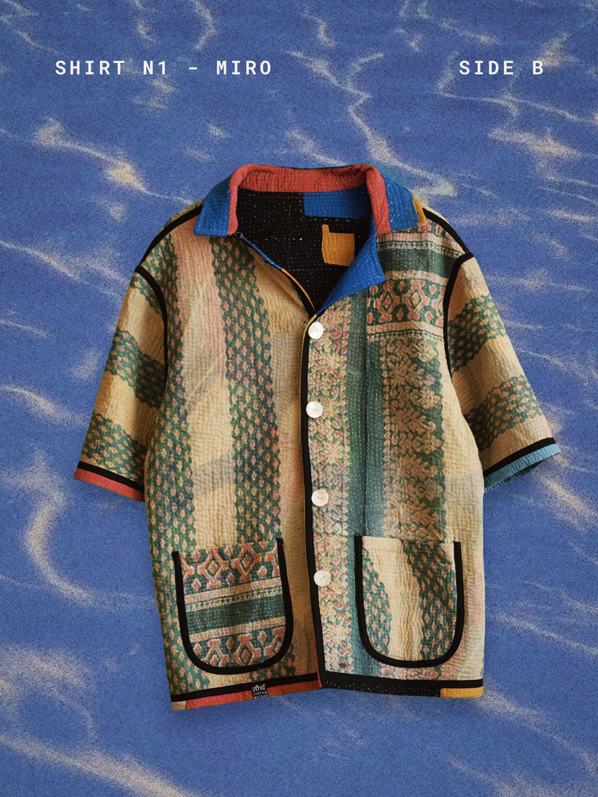 Patterned shirt on a blue textured background TIRTHA-STUDIO-MIRO-SHIRT-TWO-EXTRA-LIVES2